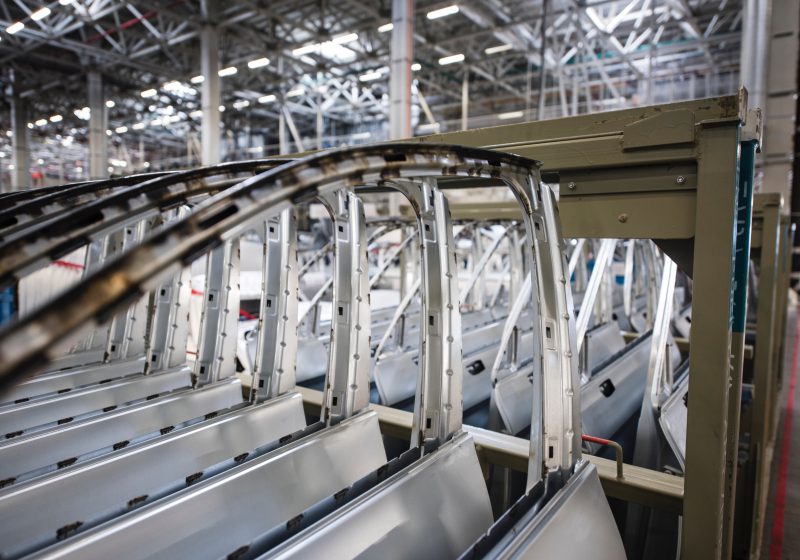 Interior of an automotive manufacturing facility with car door parts in Macon.