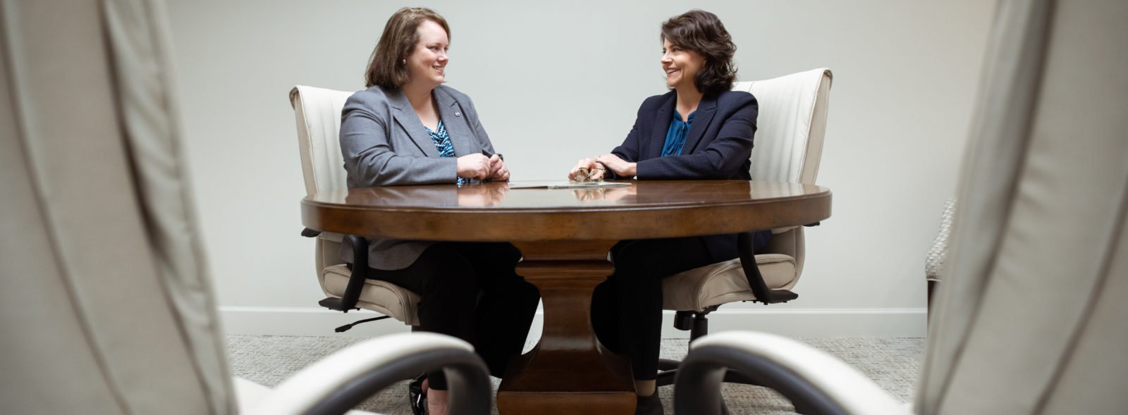 two women at conference table